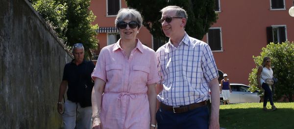 Britain Prime Minister Theresa May, left, walks with her husband Philip as they visit Desenzano del Garda, by the Garda lake, northern Italy, Tuesday, July 25, 2017. May is spending her holidays in northern Italy. - Sputnik International
