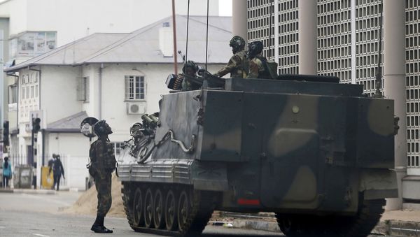 A military vehicle is seen on a street in Harare, Zimbabwe, Thursday, Nov. 16, 2017 - Sputnik International