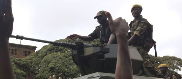 People begin to gather around a military vehicle in Harare Saturday, Nov. 18, 2017, demonstrating for the ouster of 93-year-old president Robert Mugabe who is virtually powerless and deserted by most of his allies People begin to gather around a military vehicle in Harare Saturday, Nov. 18, 2017, demonstrating for the ouster of 93-year-old president Robert Mugabe who is virtually powerless and deserted by most of his allies - Sputnik International