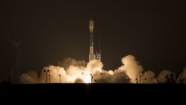 This photo provided by NASA, A Delta 2 rocket carrying the Soil Moisture Active Passive, SMAP ,satellite launches early Saturday, Jan. 31, 2015 from Vandenberg Air Force Base, Calif. - Sputnik International
