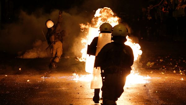 A petrol bomb explodes among riot policemen during clashes following a rally marking the 44th anniversary of a 1973 student uprising against the military dictatorship that was ruling Greece, in Athens, Greece, November 17, 2017 - Sputnik International