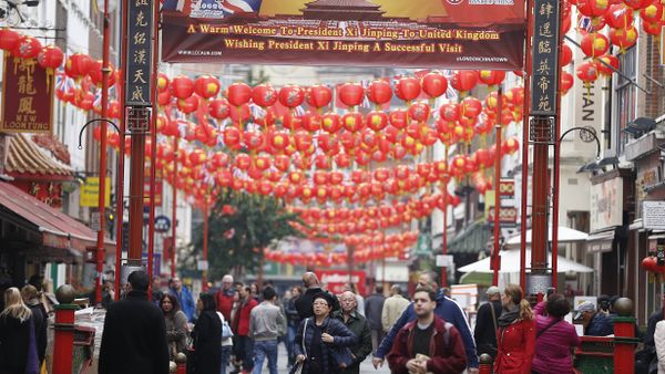 People walk through a decorated street in Chinatown, London, Friday, Oct. 16, 2015 - Sputnik International