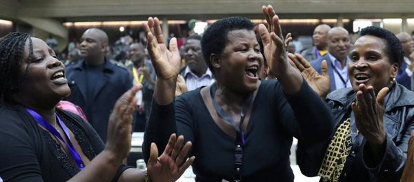 Delegates celebrate after Zimbabwean President Robert Mugabe was dismissed as party leader at an extraordinary meeting of the ruling ZANU-PF's central committee in Harare, Zimbabwe November 19, 2017 Delegates celebrate after Zimbabwean President Robert Mugabe was dismissed as party leader at an extraordinary meeting of the ruling ZANU-PF's central committee in Harare, Zimbabwe November 19, 2017 - Sputnik International