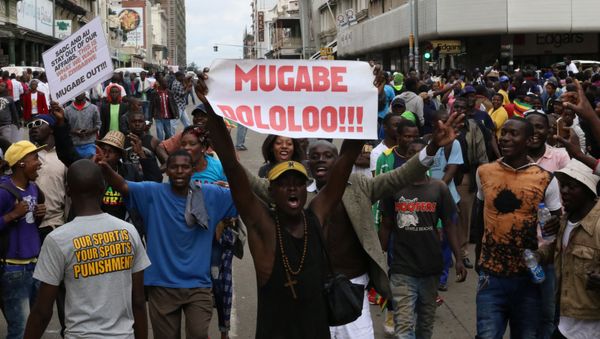 Protesters calling for Zimbabwean President Robert Mugabe to step down take to the streets in Harare, Zimbabwe November 18, 2017 Protesters calling for Zimbabwean President Robert Mugabe to step down take to the streets in Harare, Zimbabwe November 18, 2017 - Sputnik International
