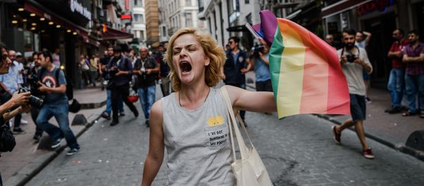A LGBT member waves a rainbow flag during a rally staged by the LGBT community on Istiklal avenue in Istanbul on June 26, 2016 A LGBT member waves a rainbow flag during a rally staged by the LGBT community on Istiklal avenue in Istanbul on June 26, 2016 - Sputnik International