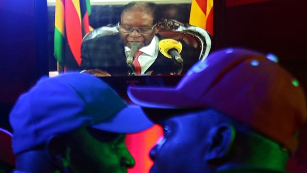 People watch as Zimbabwean President Robert Mugabe addresses the nation on television, at a bar in Harare, Zimbabwe, November 19, 2017 People watch as Zimbabwean President Robert Mugabe addresses the nation on television, at a bar in Harare, Zimbabwe, November 19, 2017 - Sputnik International