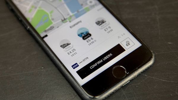 A photo illustration shows the Uber app on a mobile telephone, as it is held up for a posed photograph, in London, Britain November 10, 2017. - Sputnik International