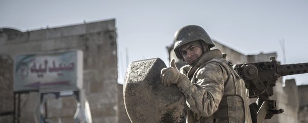In this February 22, 2015, file photo, a soldier gives the thumbs up as Turkish army's armored vehicles and tanks roll in Syrian town of Ayn al-Arab, also known as Kobani, as they return from the Ottoman tomb in Syria. - Sputnik International