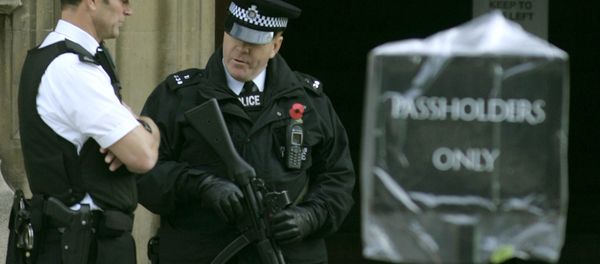Armed police stand outside an entrance to the Palace of Westminster, in London. Armed police stand outside an entrance to the Palace of Westminster, in London. - Sputnik International