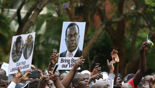 Protesters hold posters showing support for former vice-President Emmerson Mnangagwa, in Harare, Zimbabwe, November 18, 2017 Protesters hold posters showing support for former vice-President Emmerson Mnangagwa, in Harare, Zimbabwe, November 18, 2017 - Sputnik International