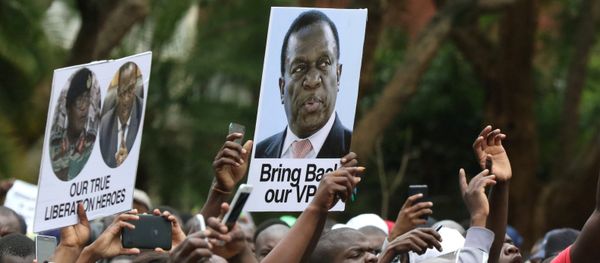 Protesters hold posters showing support for former vice-President Emmerson Mnangagwa, in Harare, Zimbabwe, November 18, 2017 Protesters hold posters showing support for former vice-President Emmerson Mnangagwa, in Harare, Zimbabwe, November 18, 2017 - Sputnik International