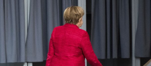 German Chancellor Angela Merkel leaves a plenary session of German parliament Bundestag in Berlin, Tuesday, Nov. 21, 2017 German Chancellor Angela Merkel leaves a plenary session of German parliament Bundestag in Berlin, Tuesday, Nov. 21, 2017 - Sputnik International