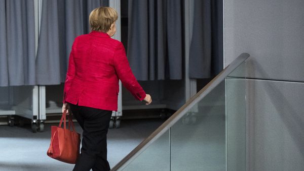 German Chancellor Angela Merkel leaves a plenary session of German parliament Bundestag in Berlin, Tuesday, Nov. 21, 2017 - Sputnik International