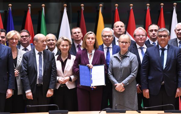 European Union foreign policy chief Federica Mogherini, center, poses with EU foreign and defense ministers after signing the notification on Permanent Structure Cooperation (PESCO) on the margin of a foreign affairs council at the Europa building in Brussels European Union foreign policy chief Federica Mogherini, center, poses with EU foreign and defense ministers after signing the notification on Permanent Structure Cooperation (PESCO) on the margin of a foreign affairs council at the Europa building in Brussels - Sputnik International
