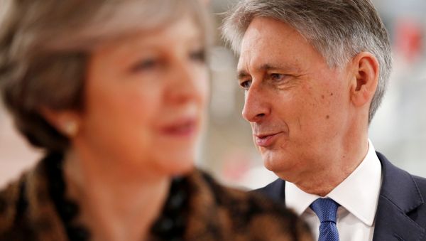 Britain's Prime Minister Theresa May and Chancellor of the Exchequer Philip Hammond visit an engineering training facility in the West Midlands, November 20, 2017. Britain's Prime Minister Theresa May and Chancellor of the Exchequer Philip Hammond visit an engineering training facility in the West Midlands, November 20, 2017. - Sputnik International