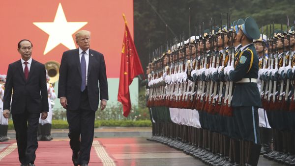 President Donald Trump, second from left, and Vietnamese President Tran Dai Quang review honor guard during an arrival ceremony at the Presidential Palace, Sunday, Nov. 12, 2017, in Hanoi, Vietnam. President Donald Trump, second from left, and Vietnamese President Tran Dai Quang review honor guard during an arrival ceremony at the Presidential Palace, Sunday, Nov. 12, 2017, in Hanoi, Vietnam. - Sputnik International