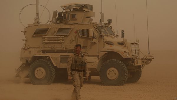In this Monday, Nov. 6, 2017 photo, U.S. Marines prepare to build a military site during a sandstorm in western Anbar, Iraq. The US-led coalition's newest outpost in the fight against the Islamic State group is in this dusty corner of western Iraq near the border with Syria where several hundred American Marines operate close to the battlefront, a key factor in the recent series of swift victories against the extremists. In this Monday, Nov. 6, 2017 photo, U.S. Marines prepare to build a military site during a sandstorm in western Anbar, Iraq. The US-led coalition's newest outpost in the fight against the Islamic State group is in this dusty corner of western Iraq near the border with Syria where several hundred American Marines operate close to the battlefront, a key factor in the recent series of swift victories against the extremists. - Sputnik International