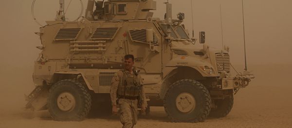 In this Monday, Nov. 6, 2017 photo, U.S. Marines prepare to build a military site during a sandstorm in western Anbar, Iraq. The US-led coalition's newest outpost in the fight against the Islamic State group is in this dusty corner of western Iraq near the border with Syria where several hundred American Marines operate close to the battlefront, a key factor in the recent series of swift victories against the extremists. - Sputnik International
