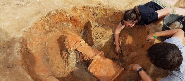 Nero tiles being unearthed at the kiln site. - Sputnik International