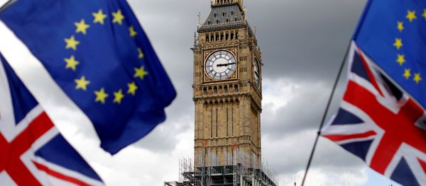 Union Flags and European Union flags fly near the Elizabeth Tower, housing the Big Ben bell, during the anti-Brexit 'People's March for Europe', in Parliament Square in central London, Britain September 9, 2017 - Sputnik International