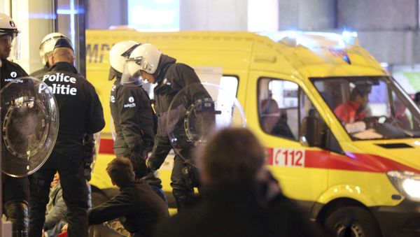 Police stand over a group of youths during unrest in Brussels on Wednesday, Nov. 15, 2017 - Sputnik International