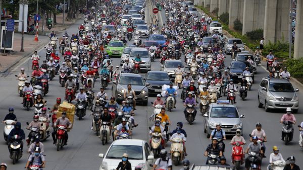 In this June 21, 2017, photo, motorbikes and cars fight for space on a street in Hanoi, Vietnam - Sputnik International