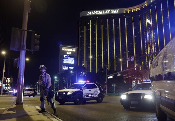 Police officers stand along the Las Vegas Strip near the Mandalay Bay resort and casino during a shooting at a country music festival, in Las Vegas. (File) Police officers stand along the Las Vegas Strip near the Mandalay Bay resort and casino during a shooting at a country music festival, in Las Vegas. (File) - Sputnik International