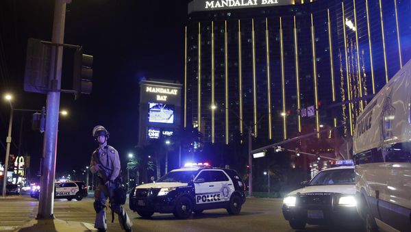 Police officers stand along the Las Vegas Strip near the Mandalay Bay resort and casino during a shooting at a country music festival, in Las Vegas. (File) - Sputnik International
