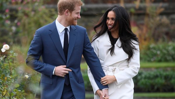 Britain's Prince Harry poses with Meghan Markle in the Sunken Garden of Kensington Palace, London, Britain - Sputnik International