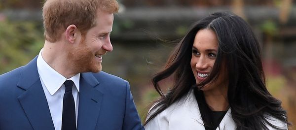 Britain's Prince Harry poses with Meghan Markle in the Sunken Garden of Kensington Palace, London, Britain - Sputnik International