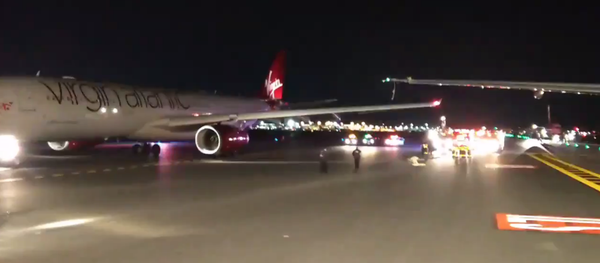 EgyptAir and Virgin Atlantic flights clip wings at JFK airport EgyptAir and Virgin Atlantic flights clip wings at JFK airport - Sputnik International
