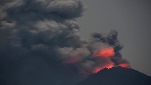 Light from lava inside the crater is reflected off volcanic ash from Mount Agung, as seen from Jemeluk Beach, Karangasem, Bali, Indonesia November 28, 2017 in this photo taken by Antara Foto. Picture taken November 28, 2017 Light from lava inside the crater is reflected off volcanic ash from Mount Agung, as seen from Jemeluk Beach, Karangasem, Bali, Indonesia November 28, 2017 in this photo taken by Antara Foto. Picture taken November 28, 2017 - Sputnik International