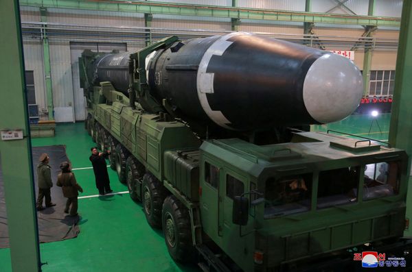 North Korea's leader Kim Jong-un is seen as the newly developed intercontinental ballistic rocket Hwasong-15's test was successfully launched, in this undated photo released by North Korea's Korean Central News Agency (KCNA) in Pyongyang November 30, 2017 - Sputnik International