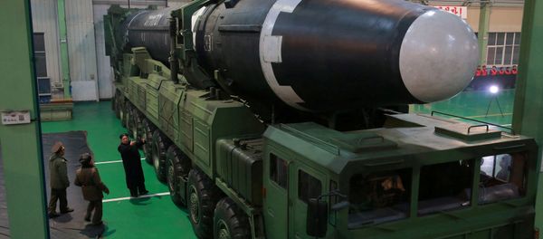 North Korea's leader Kim Jong-un is seen as the newly developed intercontinental ballistic rocket Hwasong-15's test was successfully launched, in this undated photo released by North Korea's Korean Central News Agency (KCNA) in Pyongyang November 30, 2017 North Korea's leader Kim Jong-un is seen as the newly developed intercontinental ballistic rocket Hwasong-15's test was successfully launched, in this undated photo released by North Korea's Korean Central News Agency (KCNA) in Pyongyang November 30, 2017 - Sputnik International