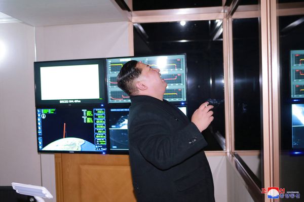 North Korea's leader Kim Jong-un is seen as the newly developed intercontinental ballistic rocket Hwasong-15's test was successfully launched, in this undated photo released by North Korea's Korean Central News Agency (KCNA) in Pyongyang November 30, 2017 - Sputnik International