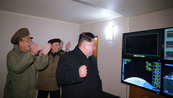 North Korea's leader Kim Jong-un is seen as the newly developed intercontinental ballistic rocket Hwasong-15's test was successfully launched, in this undated photo released by North Korea's Korean Central News Agency (KCNA) in Pyongyang November 30, 2017 - Sputnik International