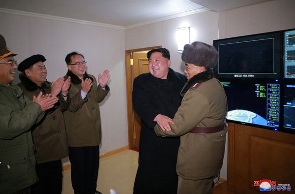 North Korea's leader Kim Jong-un is seen as the newly developed intercontinental ballistic rocket Hwasong-15's test was successfully launched, in this undated photo released by North Korea's Korean Central News Agency (KCNA) in Pyongyang November 30, 2017 - Sputnik International