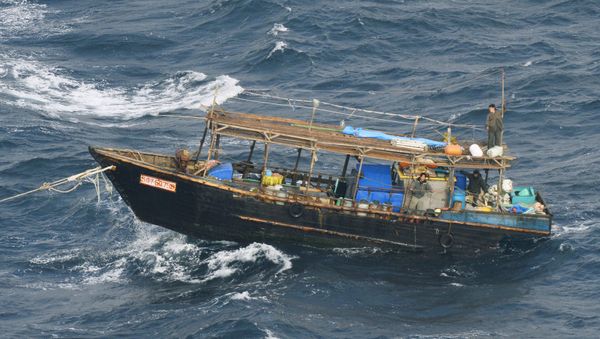 A wooden boat carrying men identified as North Koreans by coast guards drifts off Matsumae town, on Japanese northern island of Hokkaido, in this photo taken by Kyodo November 29, 2017. Picture taken November 29, 2017 A wooden boat carrying men identified as North Koreans by coast guards drifts off Matsumae town, on Japanese northern island of Hokkaido, in this photo taken by Kyodo November 29, 2017. Picture taken November 29, 2017 - Sputnik International