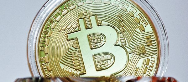 A souvenir coin of the bitcoin A souvenir coin of the bitcoin - Sputnik International