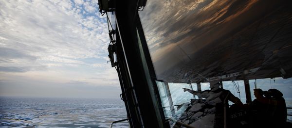Nigel Greenwood, assistant ice navigator, left, talks with second officer Ilkka Alhoke on the bridge of the Finnish icebreaker MSV Nordica as they sail through sea ice while traversing the Northwest Passage in the Canadian Arctic Archipelago, Saturday, July 22, 2017. Nigel Greenwood, assistant ice navigator, left, talks with second officer Ilkka Alhoke on the bridge of the Finnish icebreaker MSV Nordica as they sail through sea ice while traversing the Northwest Passage in the Canadian Arctic Archipelago, Saturday, July 22, 2017. - Sputnik International
