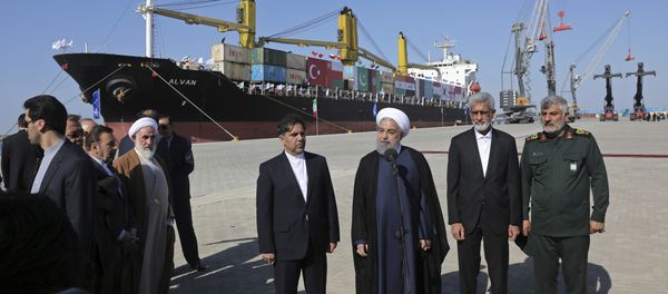 Iranian President Hassan Rouhani, center, speaks during the inauguration a newly built extension of the port of Chabahar, near the Pakistani border, on the Gulf of Oman, southeastern Iran, Sunday, Dec. 3, 2017 Iranian President Hassan Rouhani, center, speaks during the inauguration a newly built extension of the port of Chabahar, near the Pakistani border, on the Gulf of Oman, southeastern Iran, Sunday, Dec. 3, 2017 - Sputnik International