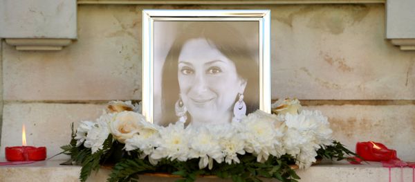 Flowers and tributes lay at the foot of the Great Siege monument in Valletta, Malta, on October 19, 2017 which has been turned into a temporary shrine for Maltese journalist and blogger Daphne Caruana Galizia (picture) who was killed by a car bomb outside her home in Bidnjia, Malta, on October 16, 2017 Flowers and tributes lay at the foot of the Great Siege monument in Valletta, Malta, on October 19, 2017 which has been turned into a temporary shrine for Maltese journalist and blogger Daphne Caruana Galizia (picture) who was killed by a car bomb outside her home in Bidnjia, Malta, on October 16, 2017 - Sputnik International