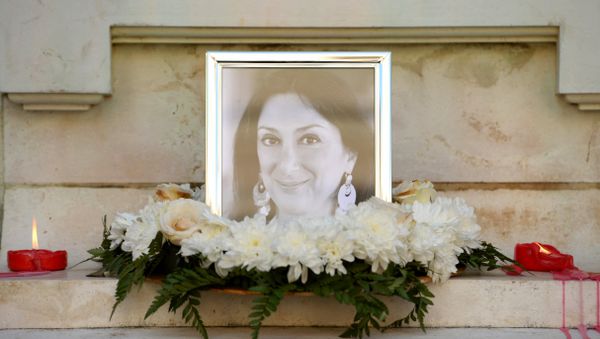 Flowers and tributes lay at the foot of the Great Siege monument in Valletta, Malta, on October 19, 2017 which has been turned into a temporary shrine for Maltese journalist and blogger Daphne Caruana Galizia (picture) who was killed by a car bomb outside her home in Bidnjia, Malta, on October 16, 2017 - Sputnik International
