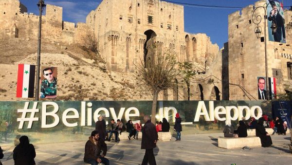 Residents on a street in Aleppo - Sputnik International