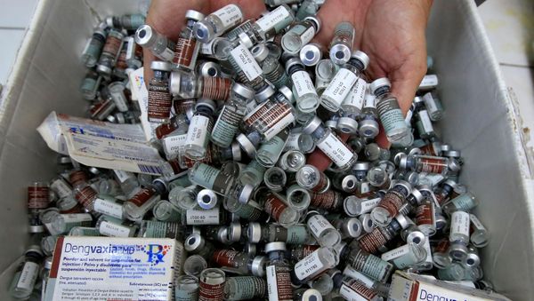 A worker shows used anti-dengue vaccine Dengvaxia inside a vaccine storage room in Sta. Cruz city, Metro Manila, Philippines December 4, 2017 A worker shows used anti-dengue vaccine Dengvaxia inside a vaccine storage room in Sta. Cruz city, Metro Manila, Philippines December 4, 2017 - Sputnik International
