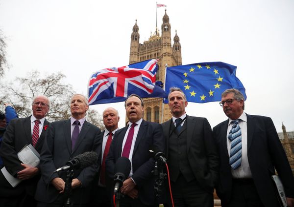Anti-Brexit protesters hold flags as Nigel Dodds, deputy leader of the Democratic Unionist Party speaks, flanked by other DUP MP's, outside the Houses of Parliament, London, Britain December 5, 2017. Anti-Brexit protesters hold flags as Nigel Dodds, deputy leader of the Democratic Unionist Party speaks, flanked by other DUP MP's, outside the Houses of Parliament, London, Britain December 5, 2017. - Sputnik International