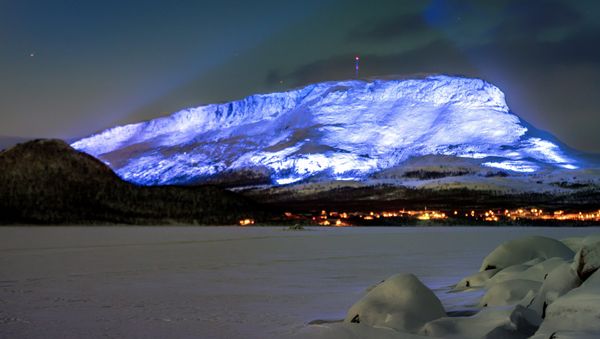 The Saana fell is lighted as part of the Luminous Finland 100 project, a light art event that will be held in honour of the 100th anniversary of Finland's independence, in Kilpisjarvi, Finland December 4, 2017 The Saana fell is lighted as part of the Luminous Finland 100 project, a light art event that will be held in honour of the 100th anniversary of Finland's independence, in Kilpisjarvi, Finland December 4, 2017 - Sputnik International