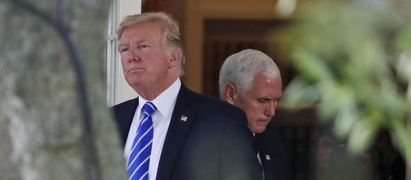 President Donald Trump steps out of the Oval Office, with Vice President Mike Pence behind him, as Trump walks to board Marine One at the White House, Tuesday, Sept. 26, 2017, in Washington President Donald Trump steps out of the Oval Office, with Vice President Mike Pence behind him, as Trump walks to board Marine One at the White House, Tuesday, Sept. 26, 2017, in Washington - Sputnik International
