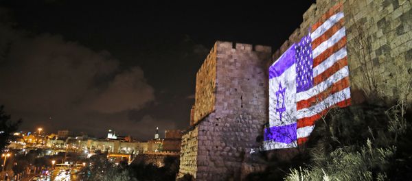 Giant US flag screened alongside Israel's national flag by the Jerusalem municipality on the walls of the old city Giant US flag screened alongside Israel's national flag by the Jerusalem municipality on the walls of the old city - Sputnik International