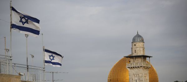 Israeli flags fly near the Dome of the Rock in the Al-Aqsa mosque compound - Sputnik International